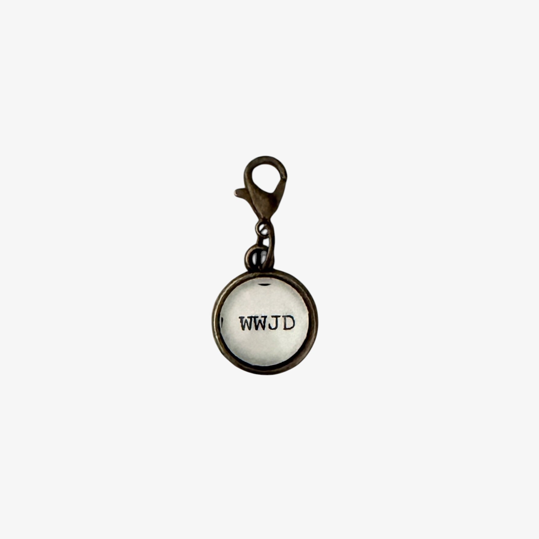 Round charm with 'WWJD' text on a white background