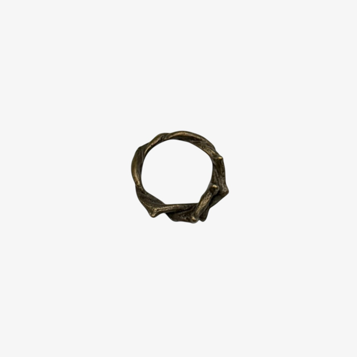 Bronze crown of thorns charm on a white background
