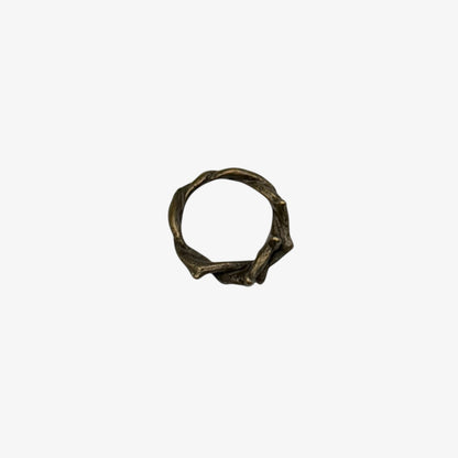 Bronze crown of thorns charm on a white background