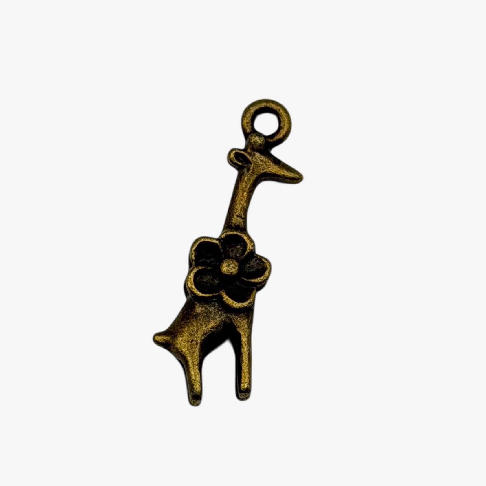 Bronze-colored giraffe charm on a white background