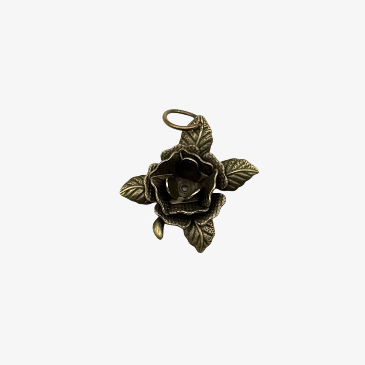 Bronze rose-shaped pendant on a white background