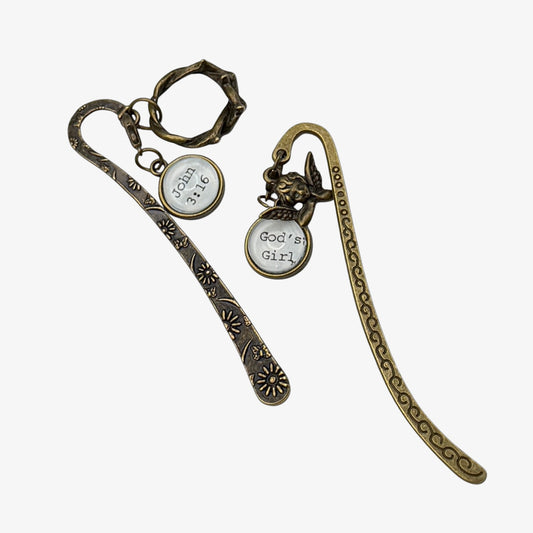 Two bronze bookmarks with circular charms on a white background