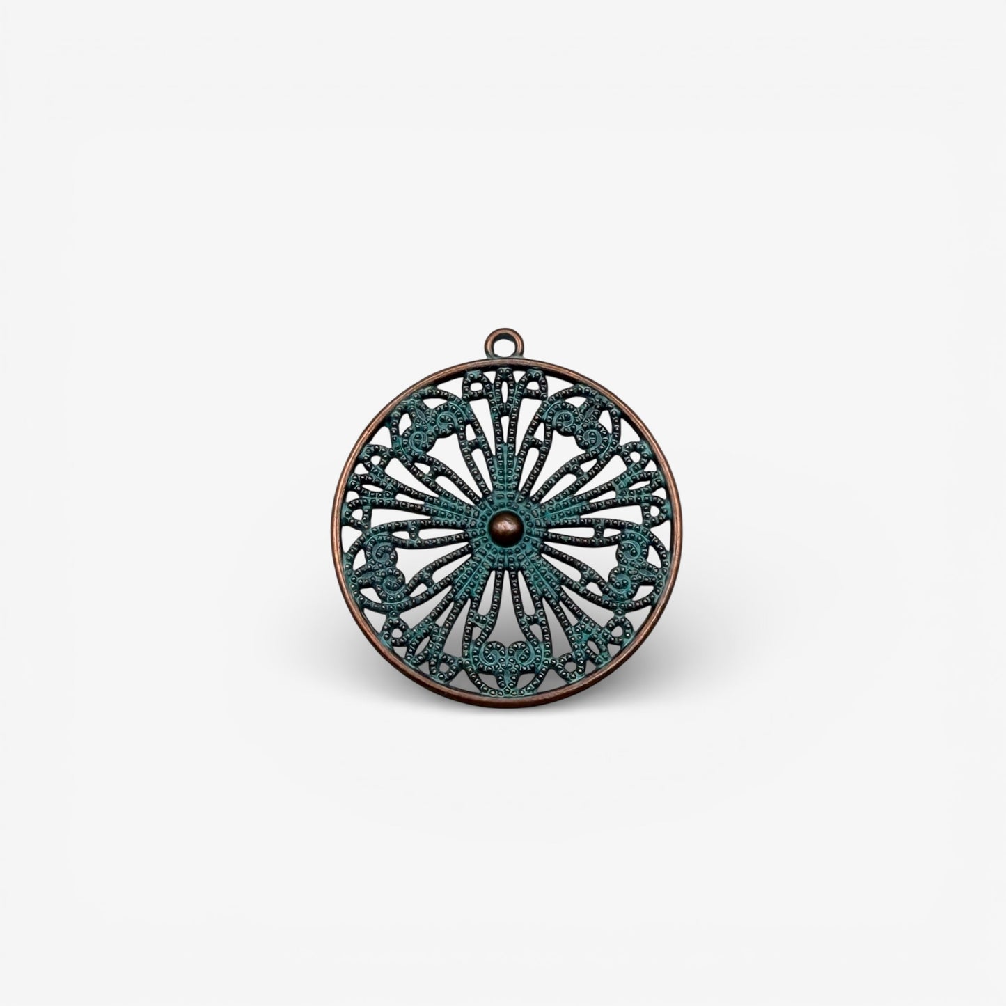 Decorative pendant with intricate design on a white background