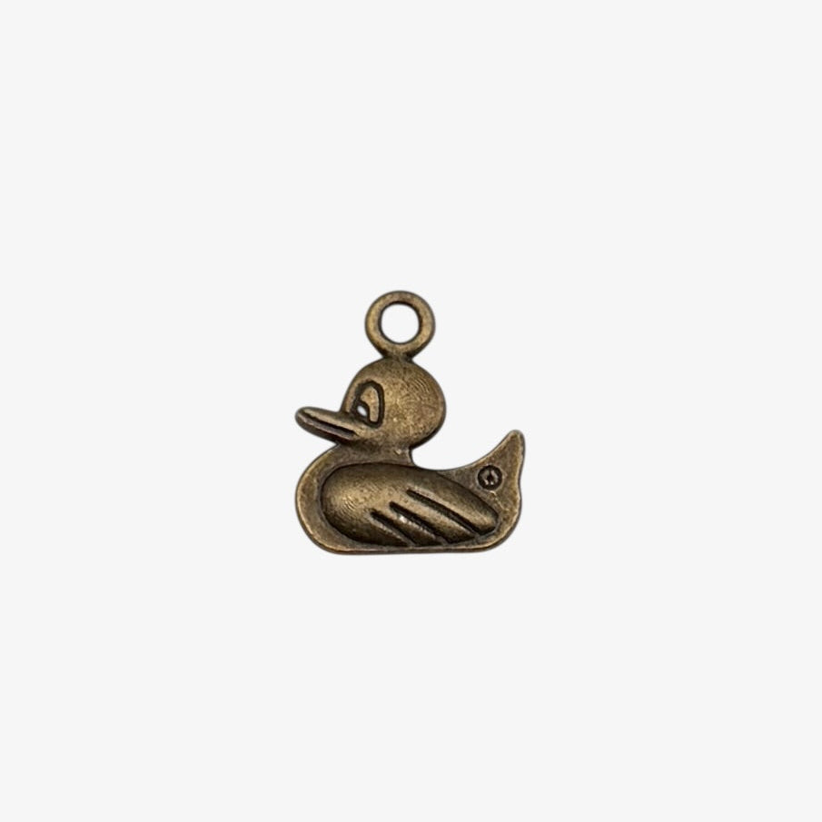 Bronze duck-shaped pendant on a white background