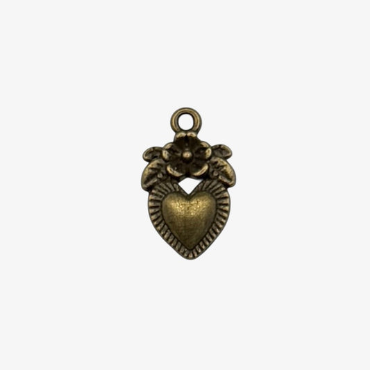 Bronze heart-shaped pendant with floral design on a white background