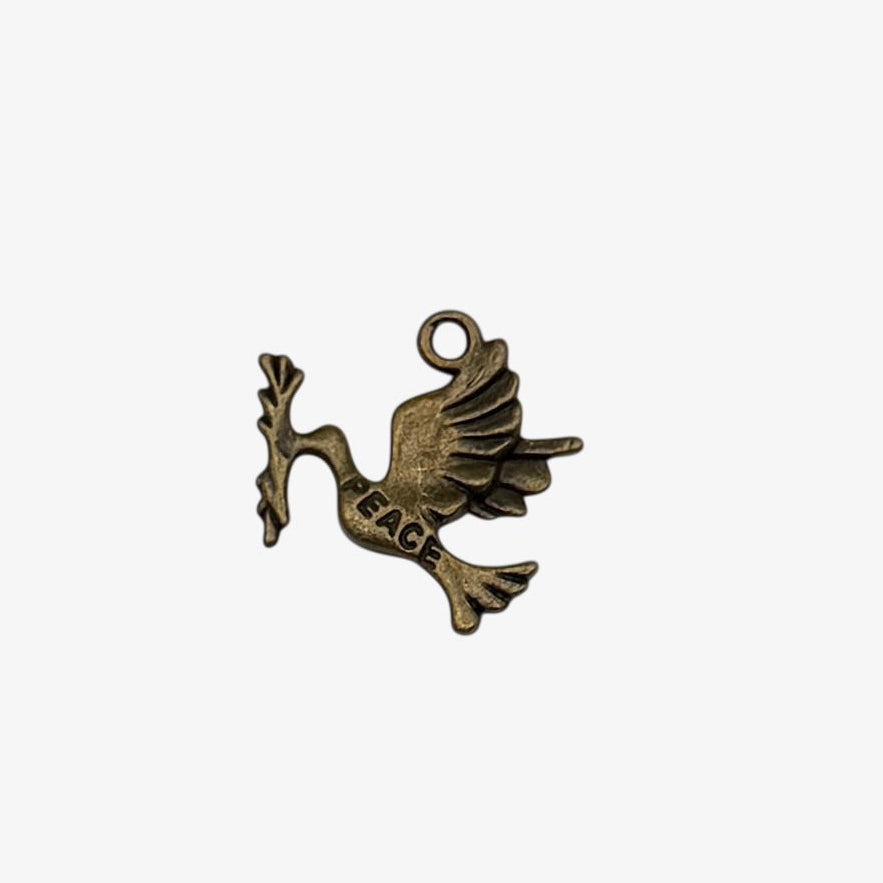 Bronze dove charm with 'PEACE' on a white background