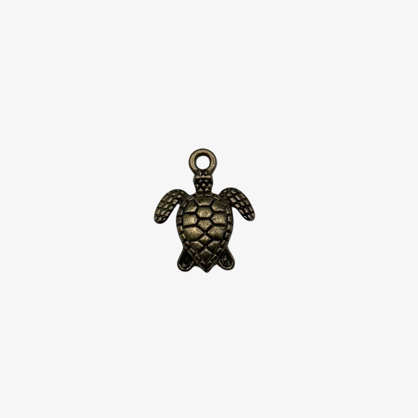 Bronze turtle pendant on a white background
