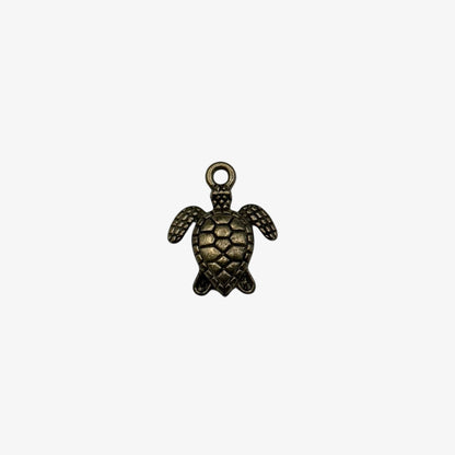 Bronze turtle pendant on a white background