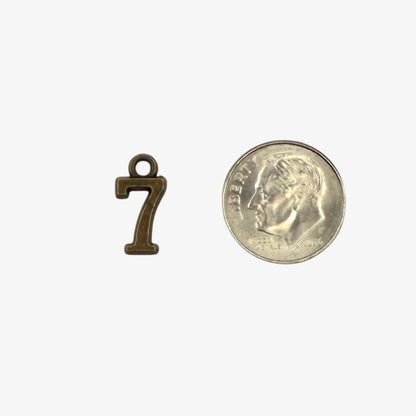Small bronze number 7 charm 