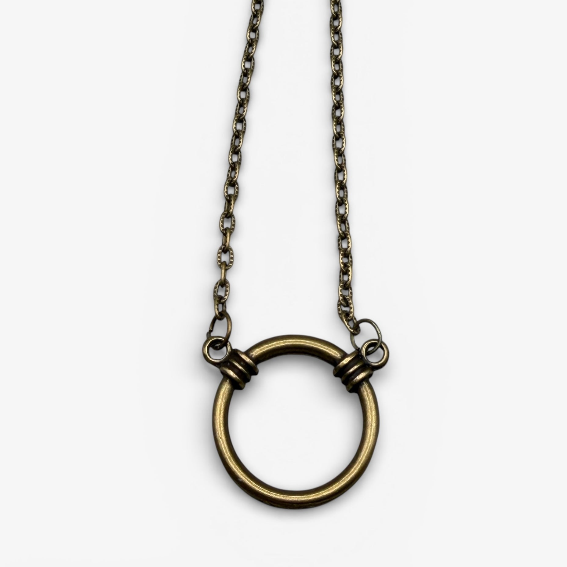 Necklace with a large circular pendant on a white background