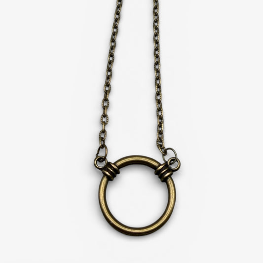 Necklace with a large circular pendant on a white background