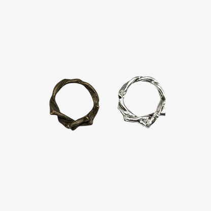 Two silver hoop earrings on a white background
