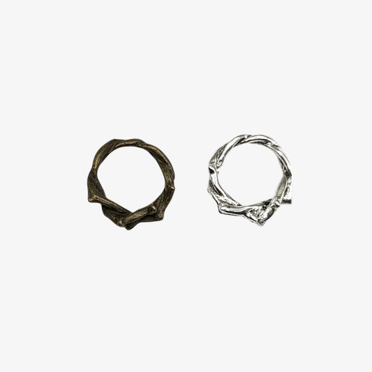 Two silver hoop earrings on a white background