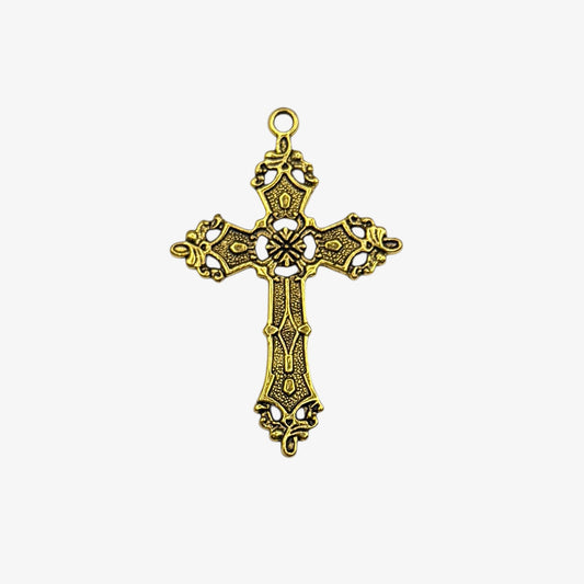 Gold cross pendant on a white background