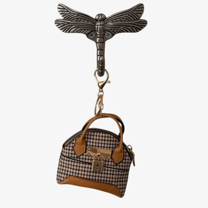 Keychain with a small handbag charm on a white background