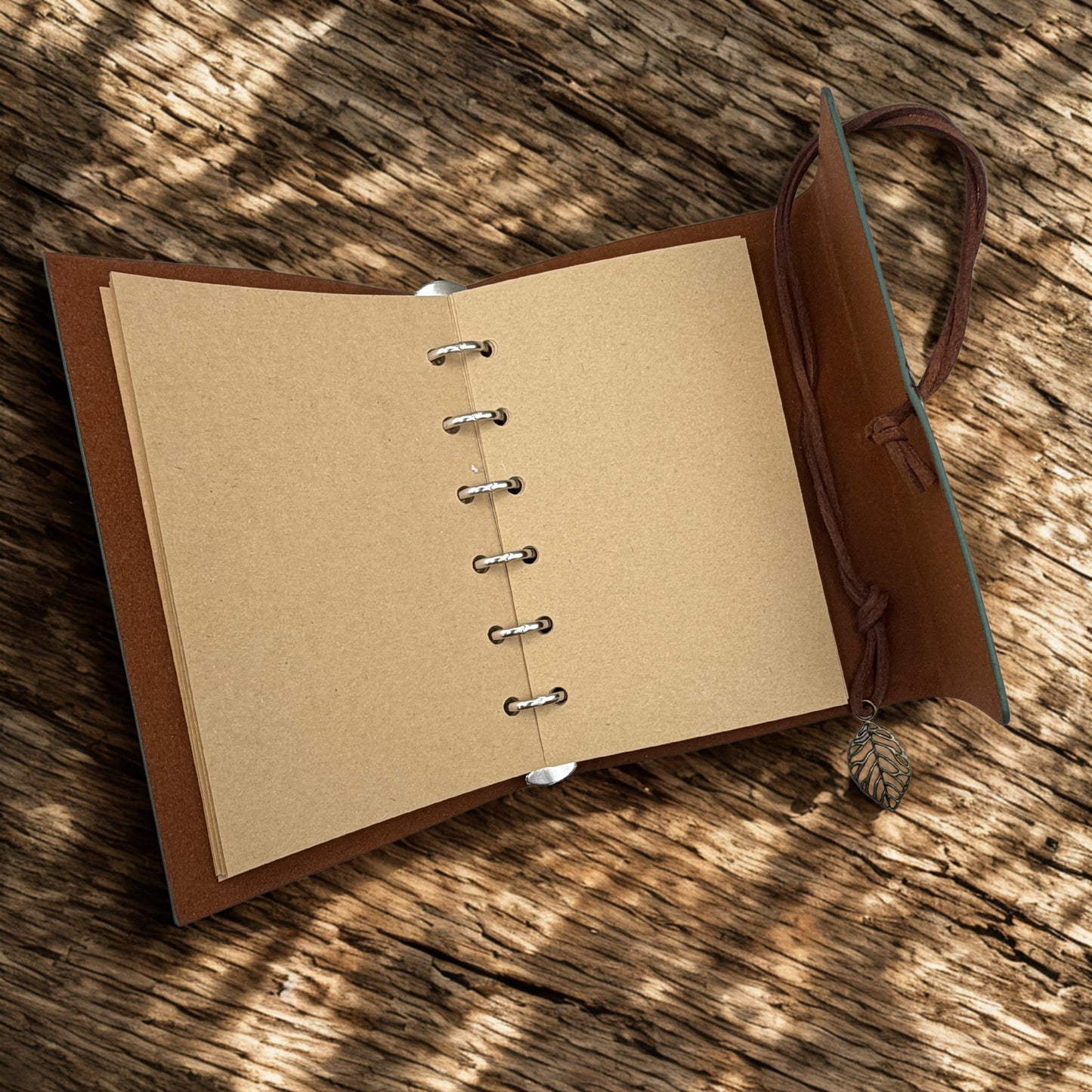 green loose-leaf notebook