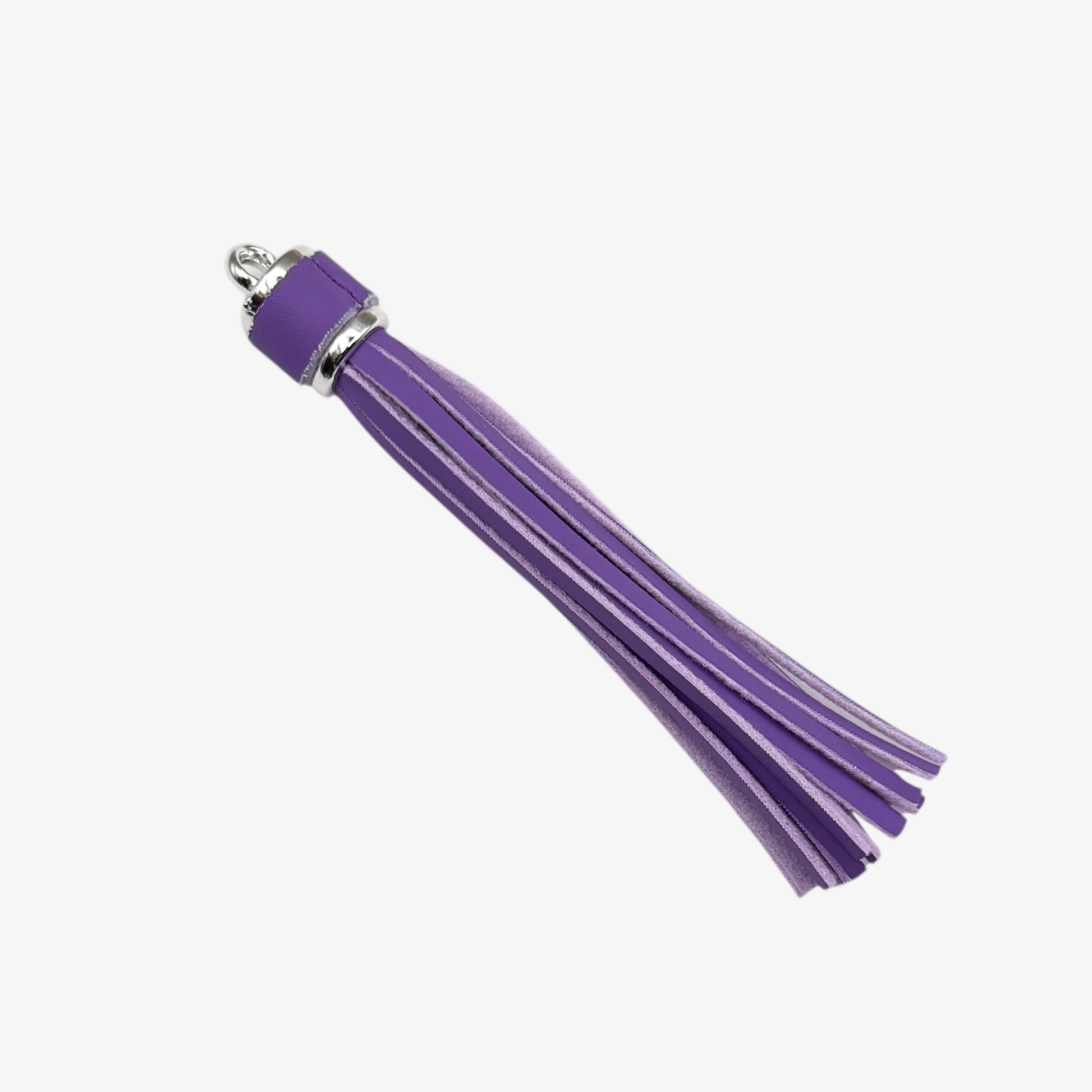 Metallic tongue depressor on a white background