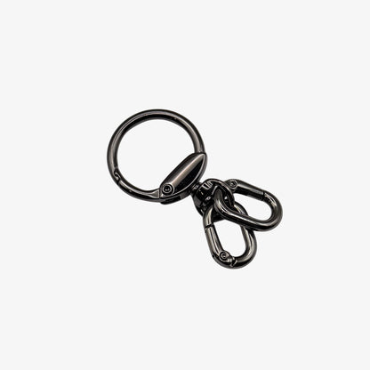 Black metal keychain with a clip on a white background
