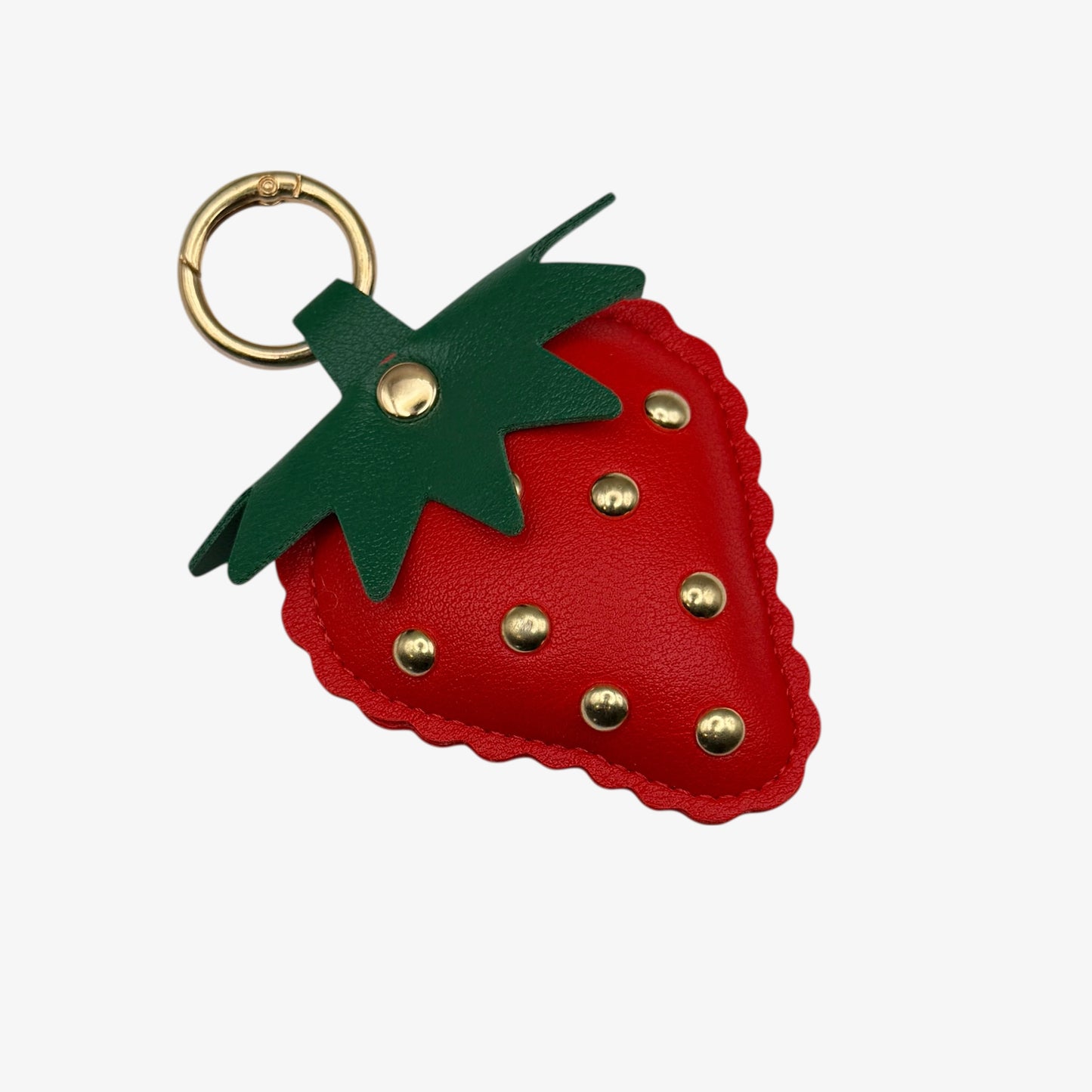 Strawberry-shaped keychain with gold studs 