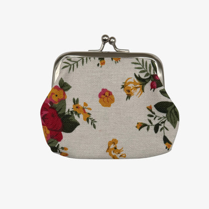 Floral patterned coin purse on a white background