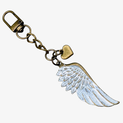 Keychain with angel wing design on a white background